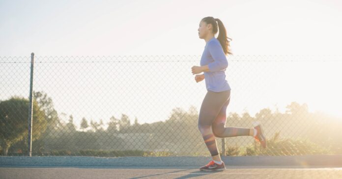 Photo by Andrew Tanglao woman jogging near wire fence