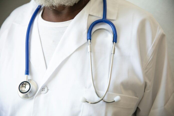 Photo by Nappy a person wearing a white shirt