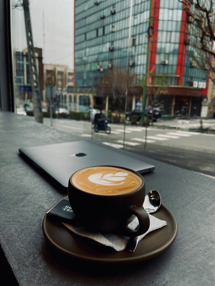 Photo by zeinab mazhari a cup of coffee sitting on top of a saucer