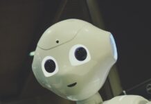 AI와 함께하는 건강 관리, 일상이 달라진다 white robot toy holding black tablet