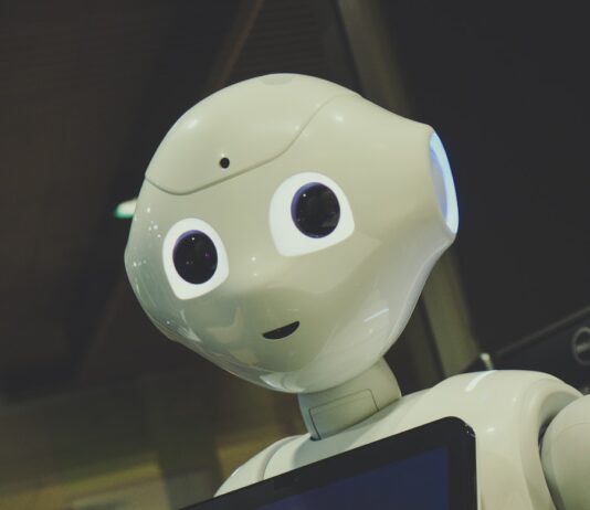 AI와 함께하는 건강 관리, 일상이 달라진다 white robot toy holding black tablet