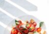 내 몸을 위한 착한 식단, 일상에서 실천하는 건강한 한 끼 습관 sliced tomato and green leaf vegetable on white ceramic plate