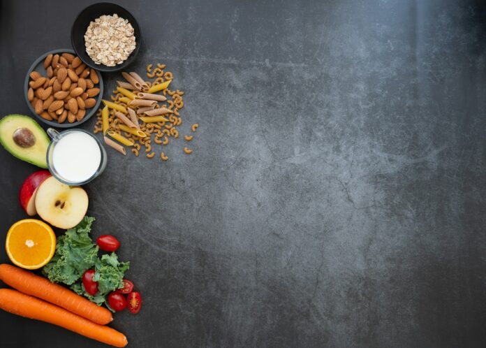Photo by Mohammad Lotfian a black table topped with fruits and vegetables